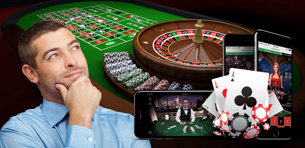 Roulette table, betting, mobile betting cards & chips with a man.